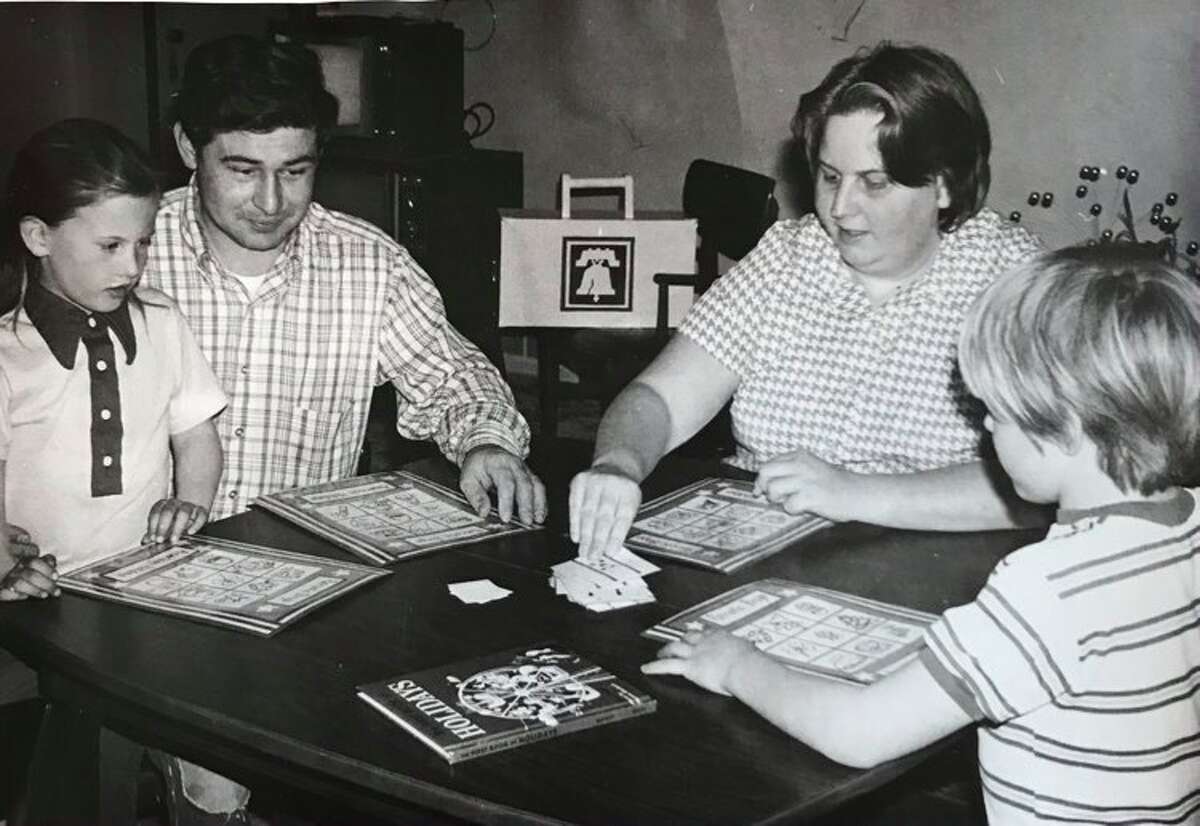This Carpenter Elementary family plays a game of patriotic bingo instead of watching TV. November 1976