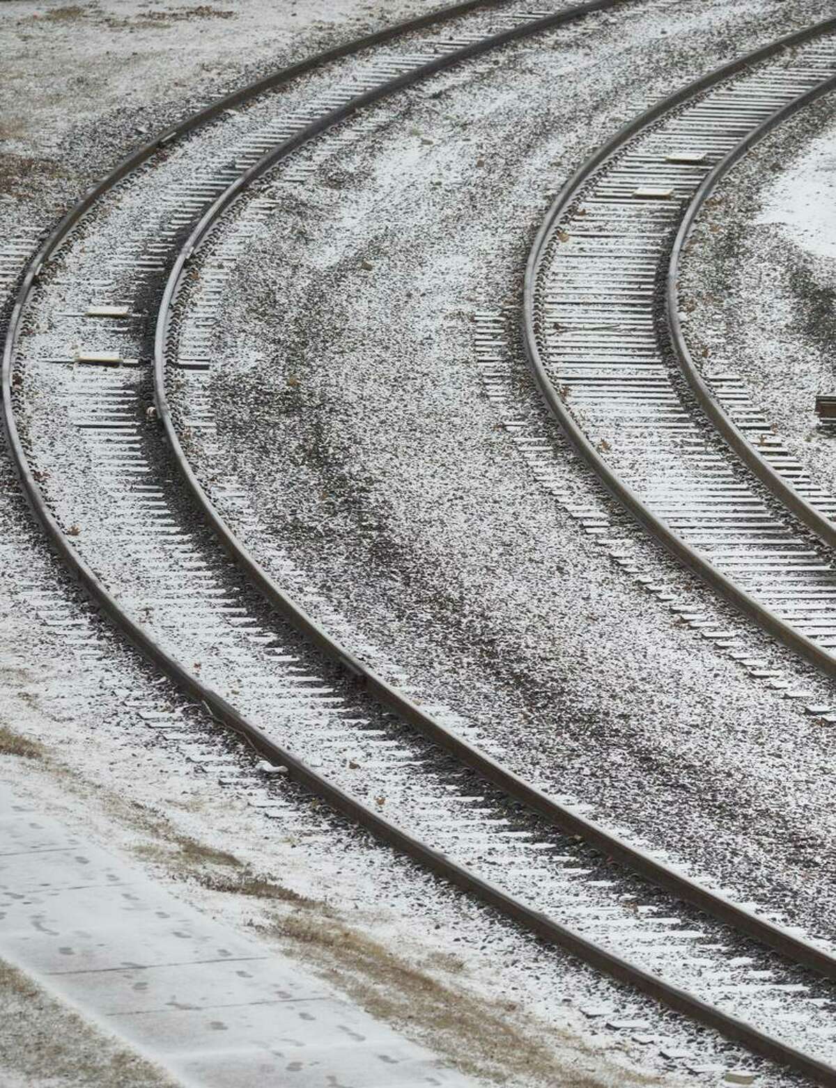 Snow outlines train tracks outside the Danbury Railway Museum.