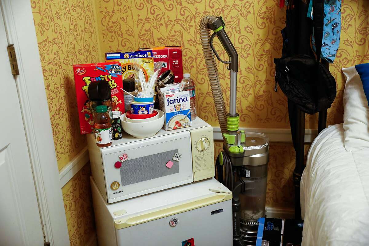 Cereal on the microwave in Chucky Torres� hotel room in the Tenderloin on Wednesday, Dec. 16, 2020 in San Francisco, California. Chucky was previously homeless and hoping to get permanent housing.