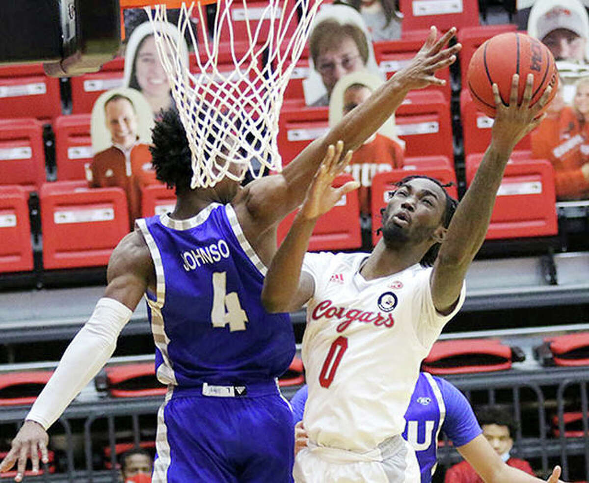 SIUE’s Sidney Wilson (0) leads the Cougars in scoring with a13.1 points-per-game average. He and his teammates will take on top-seeded Belmont Wednesday in the first round of the Ohio Valley Conference Tournament in Evansville, Ind. He is shown in action against Eastern Illinois earlier this season.