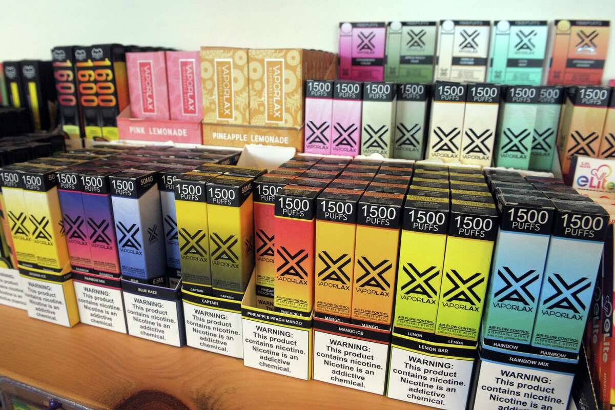 Flavored disposable vaporizing devices available at Stoked Progressive Smoke Shop, in Bridgeport, Conn. Feb. 4, 2021.