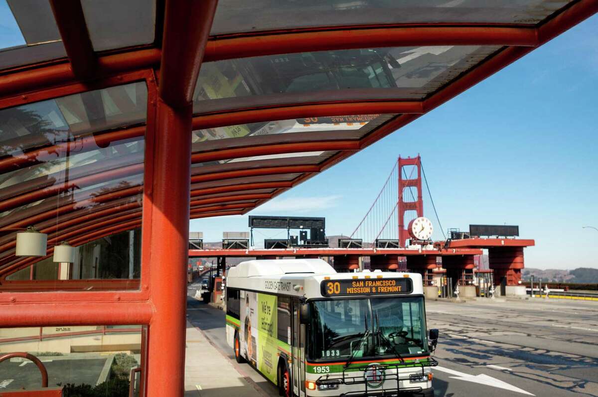 A bus passes the Golden Gate Bridge toll plaza on Nov. 10, 2020, in San Francisco.
