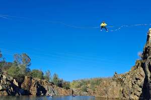 Slackliners are risking fines and jail crossing Calif. lake