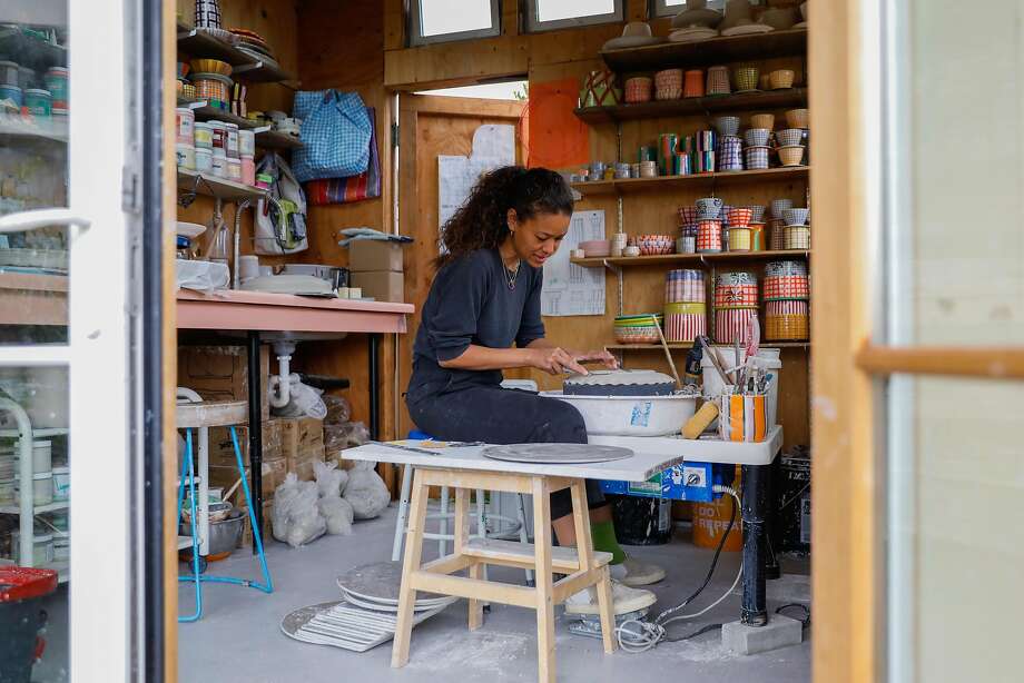 Chinzalée Sonami, owner and ceramist of Pala Ceramics, trims a piece in her Oakland studio. Photo: Gabrielle Lurie / The Chronicle