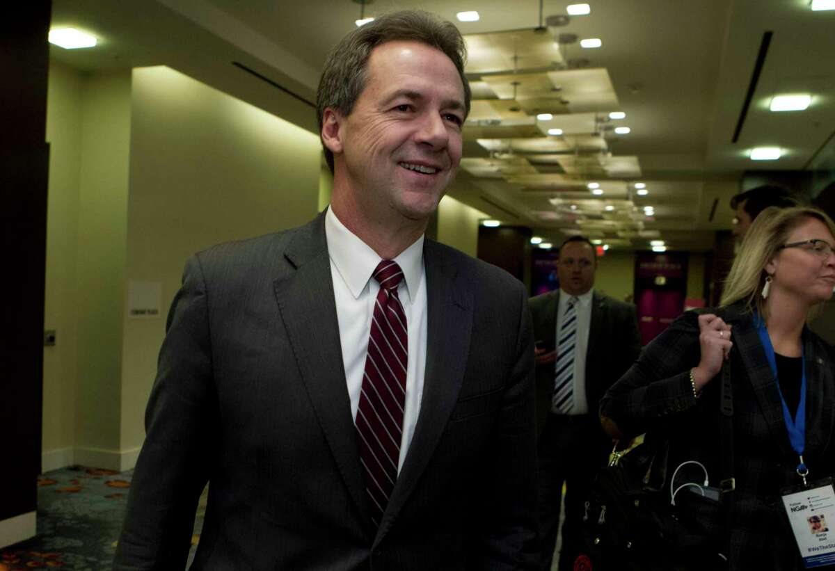 Montana Gov. Steve Bullock walks to a meeting during the National Governors Association 2019 winter meeting in Washington, on Feb. 23, 2019. Bullock, whose second term as Montana governor ended in early 2021, has been named the new monitor of OxyContin maker Purdue Pharma.