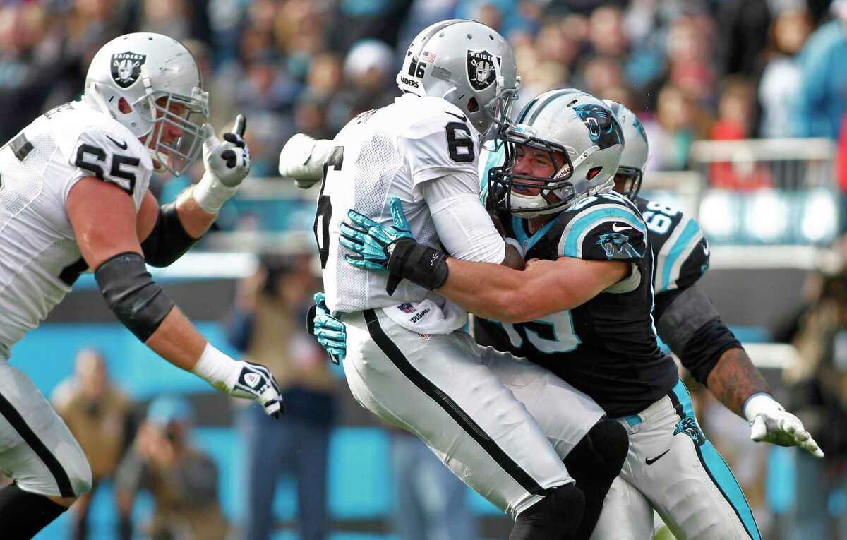 Carolina Panthers linebacker Luke Kuechly in a December 2012 game against the Oakland Raiders. Kuechly was among the athletes to test the Q-Collar, developed by Westport, Conn.-based Q30 Innovations to signal the possibility of an athlete incurring a concussion.