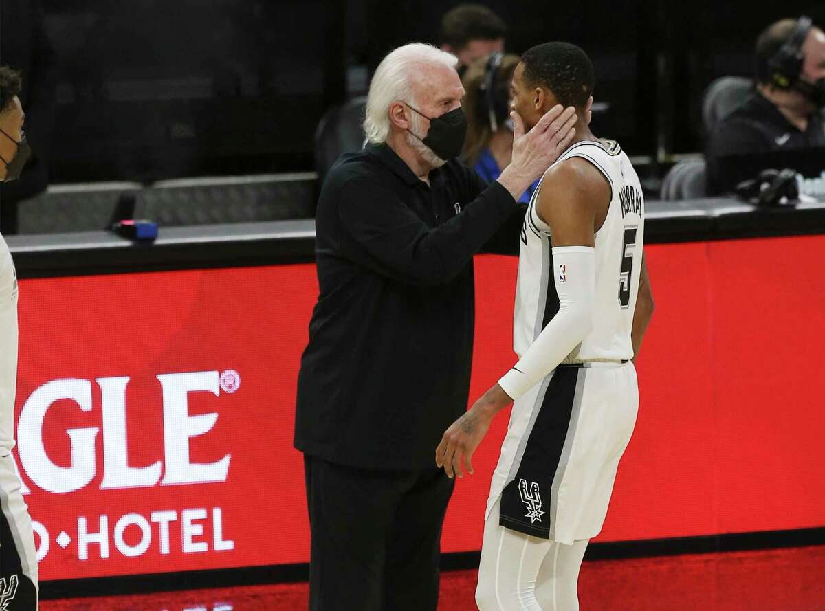 Spurs coach Gregg Popovich shows his approval of the performance by Dejounte Murray (05) against the New York Knicks at the AT&T Center on Tuesday, Mar. 2, 2021. Spurs defeated the Knicks, 119-93. Murray scored 17 points for the game.