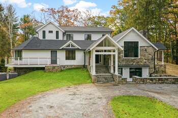 Newly constructed contemporary farmhouse at 58 Weston Woods Way, Weston.