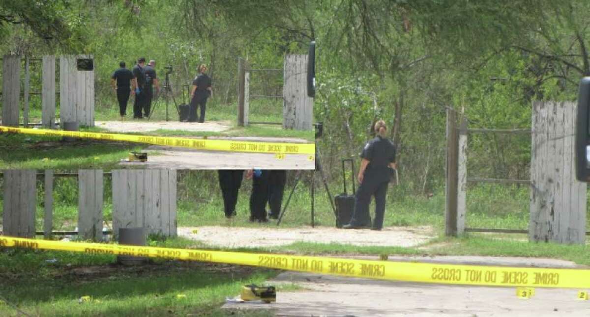 San Antonio police look for clues in the back yard of a South Side home Wednesday morning, when a man's partially decomposing body was found.