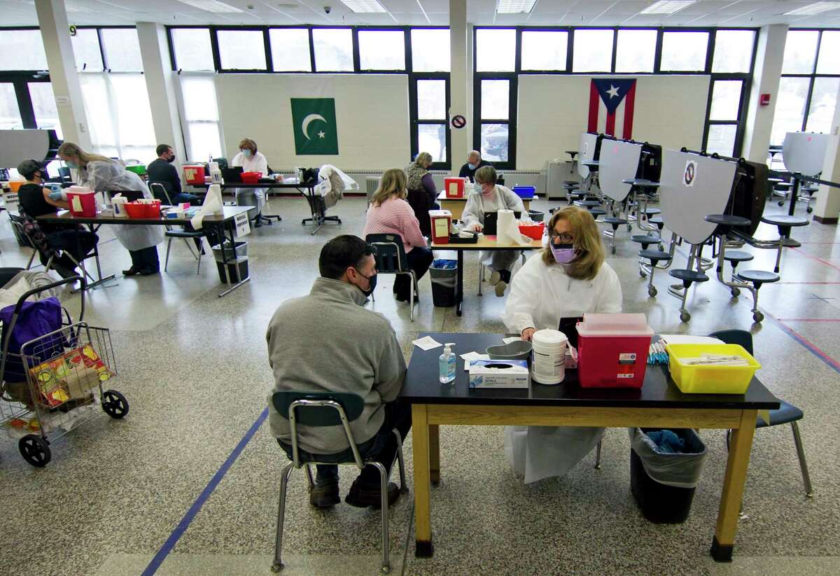 Danbury teachers and school district staff get their Moderna COVID-19 vaccination at a vaccine clinic at Rogers Park Middle School in Danbury, Conn., on Saturday Mar. 6, 2021. Over 900 teachers and staff received the Moderna vaccine during the two-day clinic.