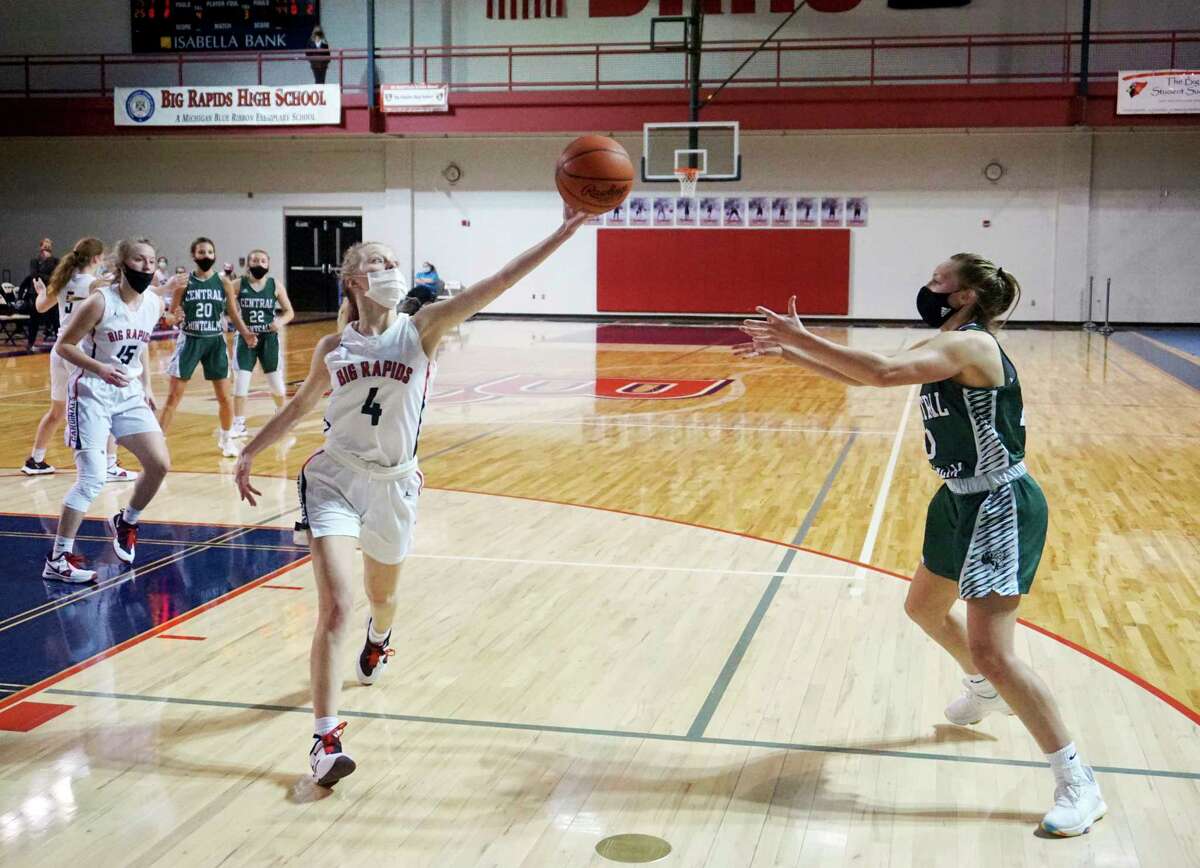 Sophomore Jenna Williams, of Big Rapids, tips the ball during an attempted pass during Wednesday night's contest with Central Montcalm. (Pioneer photo/Joe Judd)