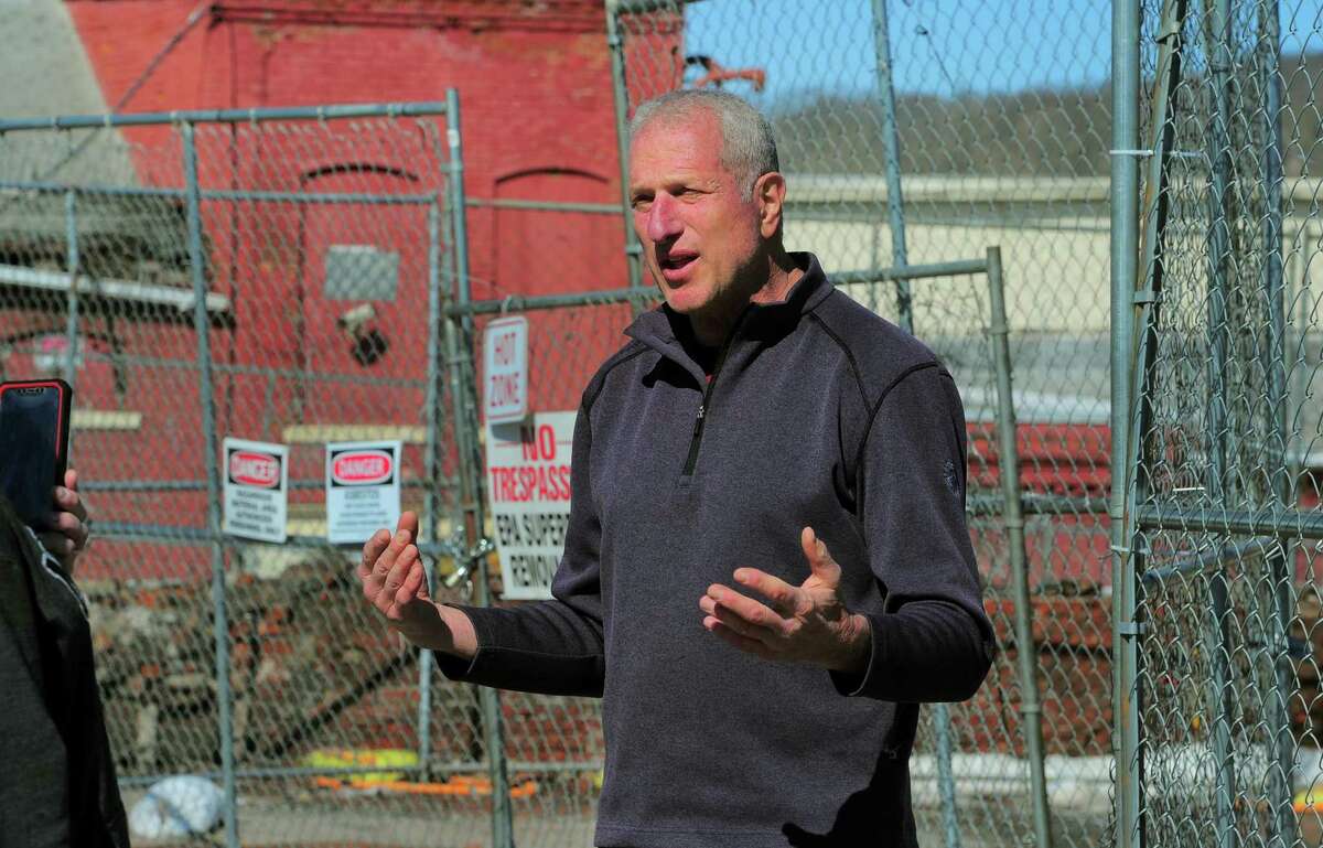 Shelton Mayor Mark Lauretti talks about plans to clean up and eventually develop the former Star Pin factory site along Canal Street in Shelton, Conn., on Friday Feb. 26, 2021. The factory was destroyed in a fire this past summer.