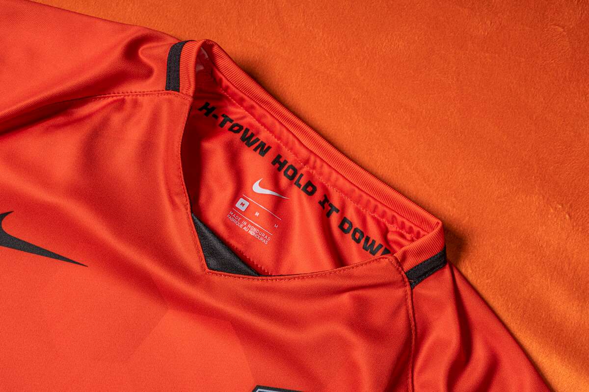 The motto of the Houston Dynamo Football Club "Lower it" inside the neckline of the new 2021 season jerseys.