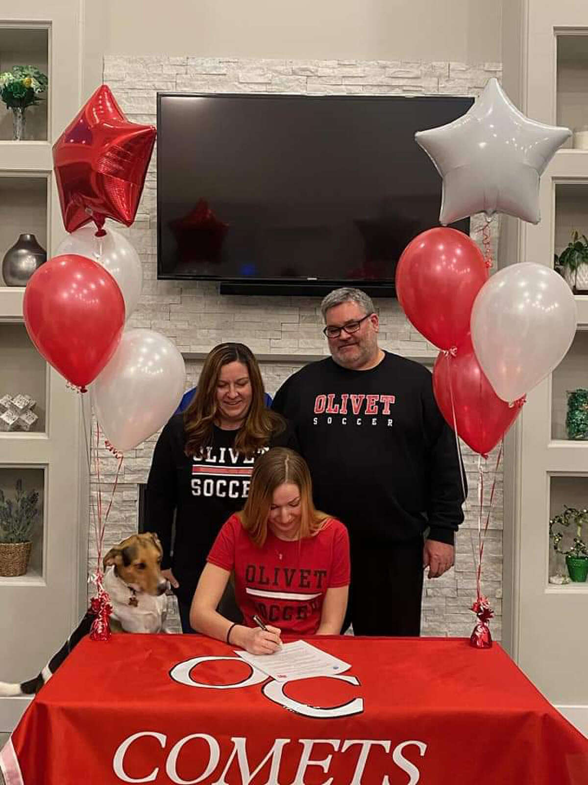 Lexie Rueggsegger signs her National Letter of Intent to play soccer at Olivet College.