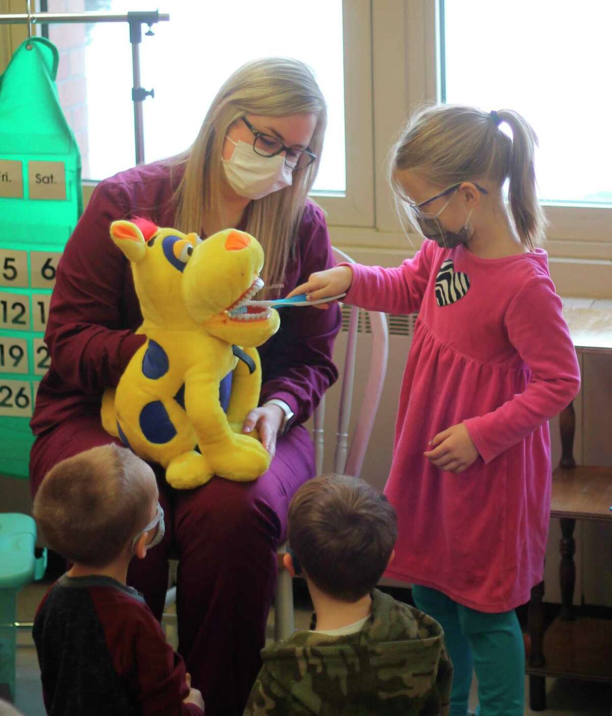 Breanna Fortin, dental hygienist of Boyer Family Dentistry, visited Trinity Lutheran School to give a presentation to preschool and kindergarten students about the importance of dental hygiene. (Kyle Kotecki/News Advocate)