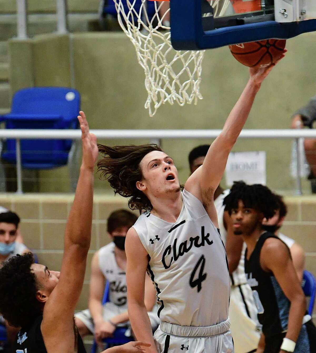 Will Harris (4) of Clark scores late in the game against Harlan during the Region IV-6A semifinal on Tuesday, March, 2, 2021. Clark won, 49-48.