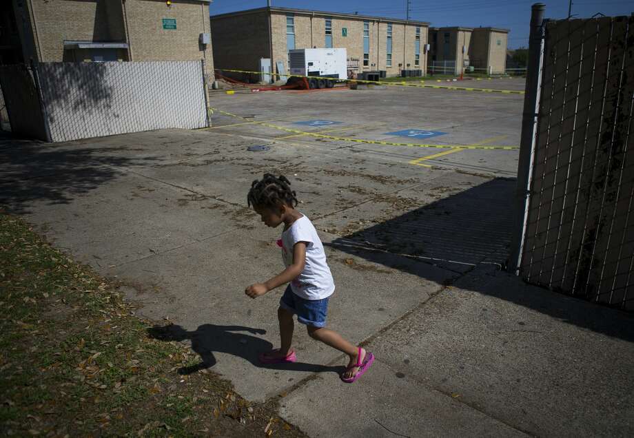 Three-year-old Peyton Johnson plays in front of her home at the Sandpiper Cove apartments, which are privately owned but subsidized by HUD. Photo: Mark Mulligan/Staff Photographer / ? 2019 Mark Mulligan / Houston Chronicle