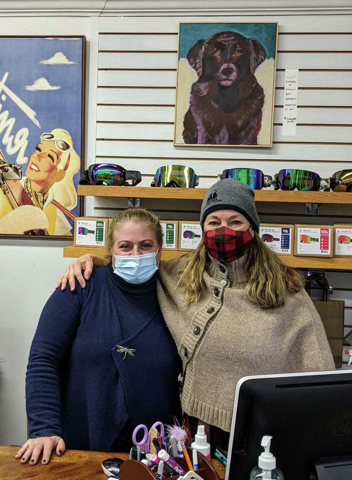 Store Owner Pam Alberino (left) with Artist Georgette DiScala Diamandis at Ski and Sport in New Canaan, Conn.