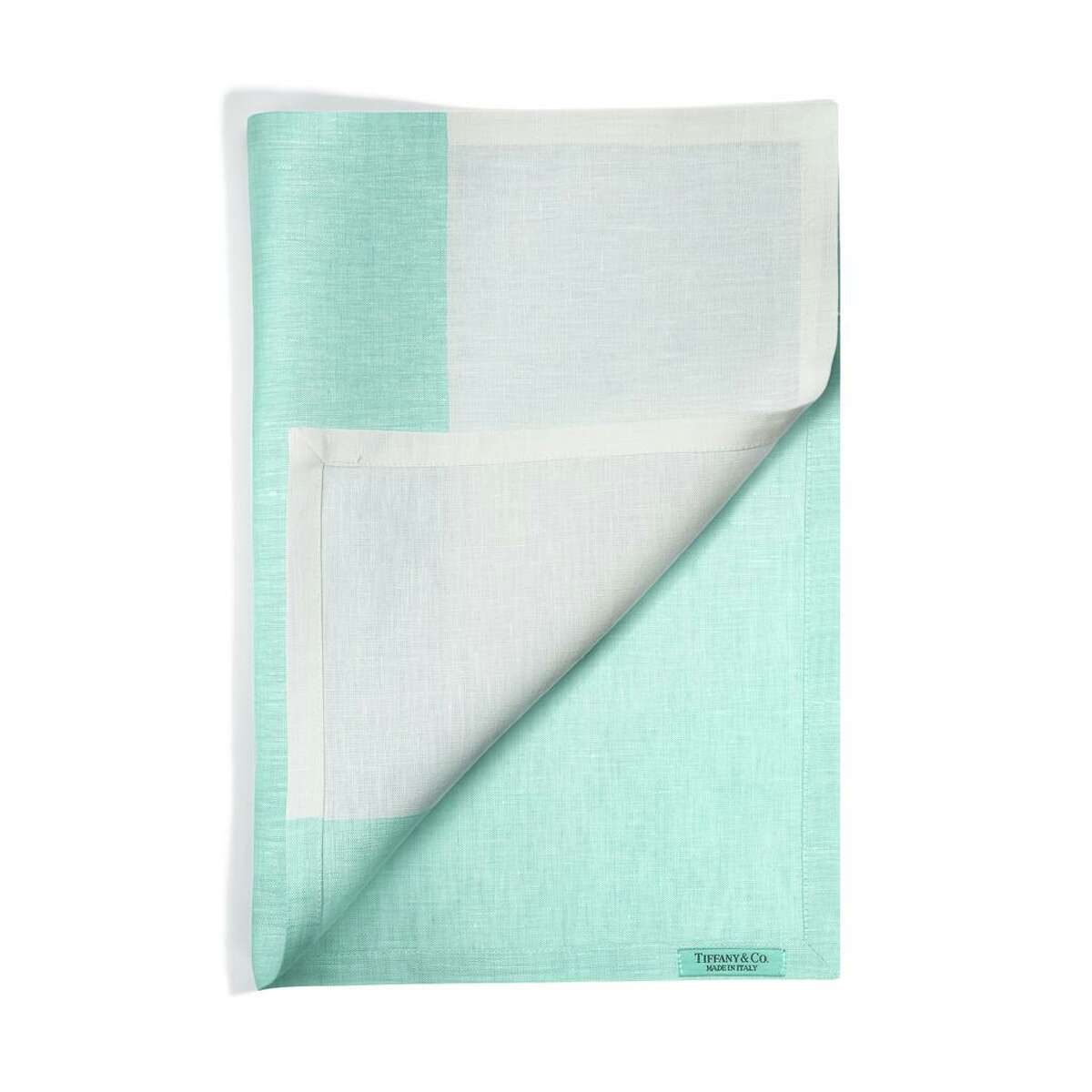 Tiffany brings a fresh and modern perspective to its Color Block Collection, blending soft ivory with its signature robin’s egg blue in dishes, napkins and placemats. $320 per place setting, $125 set of 4 napkins, $175 set of 4 placemats; Tiffany & Co.