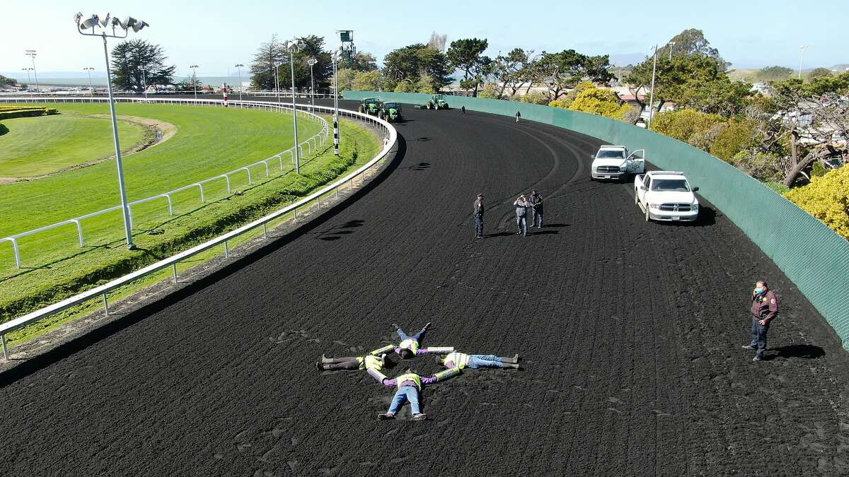 Four San Francisco Bay Area residents locked themselves together on the Golden Gate Fields racing track, canceling horse races on Thursday, March 4, 2021, in Albany, CA.