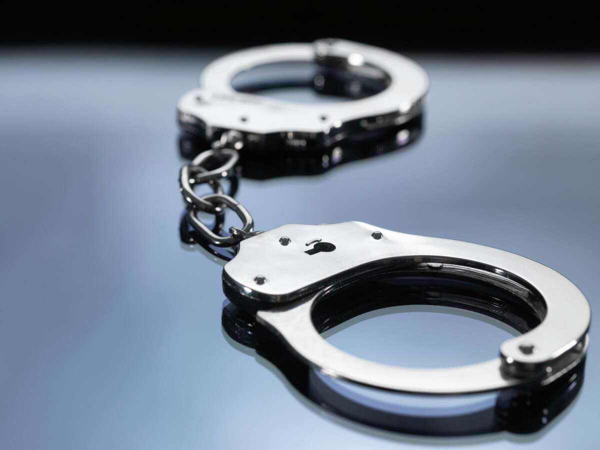 File photo of handcuffs on table. A Sunnyvale man, found with two storage units packed with stolen goods, was arrested by San Jose police and linked to multiple thefts and burglaries, the department said.