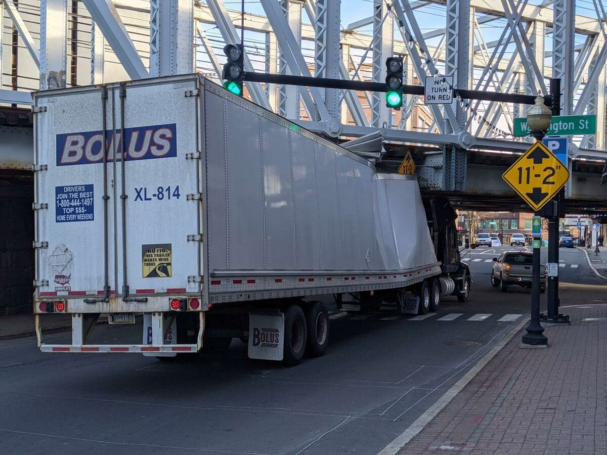 A truck hit an overpass in Norwalk, Conn., on Friday, March 5, 2021.