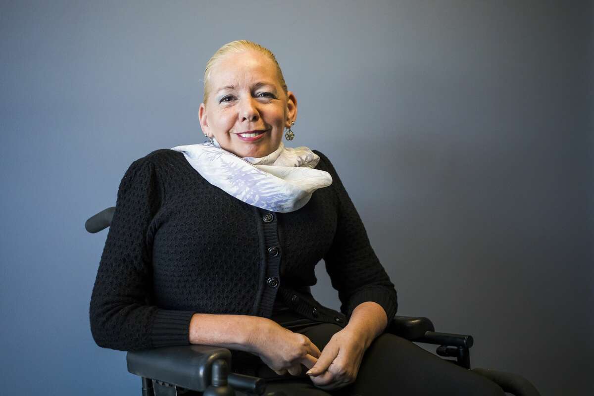 Disability Network of Mid-Michigan Executive Director Kelly PeLong poses for a portrait Monday, March 1, 2021 inside the DNMM offices in Midland. (Katy Kildee/kkildee@mdn.net)