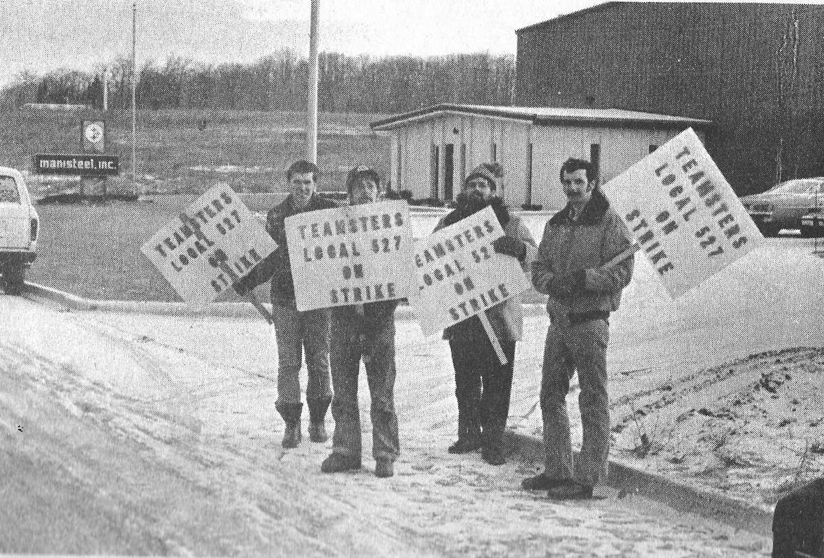 This photo was published in the News Advocate on March 6,1981. Four Manistee employees who said they have been locked out of their jobs since Dec. 23 went on strike this morning to protest their company's unwillingness to negotiate a contract which expired Dec. 8. (From left) Teamsters Local 527 members Stan Gajeski, Ron Kissel, George Yaworski and Dennis Hindman manned the picket lines this morning.  (Manistee County Historical Museum photo)