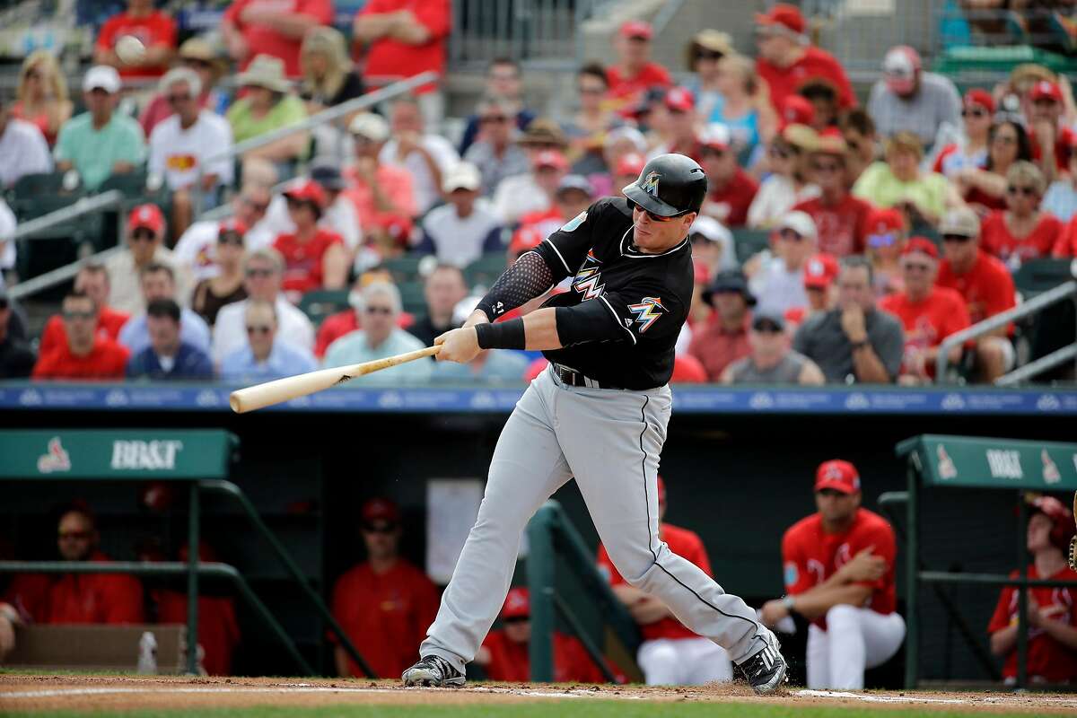 Miami Marlins' Justin Bour bats during the first inning of an exhibition spring training baseball game against the St. Louis Cardinals Thursday, March 3, 2016, in Jupiter, Fla. (AP Photo/Jeff Roberson)