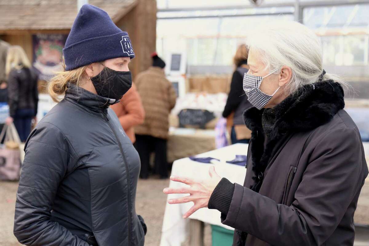 Lori Cochran-Dougall, executive director of the Westport Farmers' Market, talks to Orna Stern of Westport, who helped found the market years ago. March 2021.