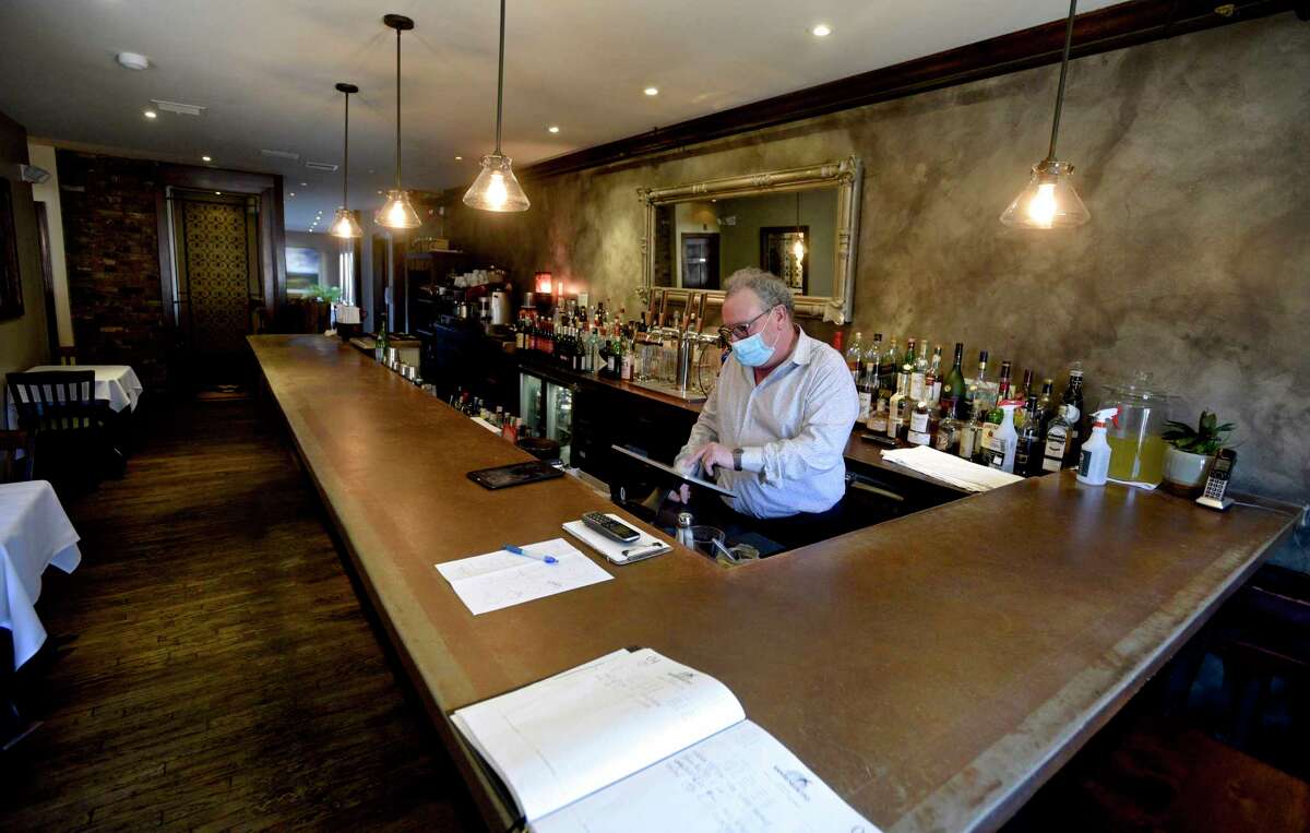 Roberto Moro, Manager, behind the bar at La Zingara Ristorante. Because of COVID restrictions there is La Zingara has no seating at the bar. Governor Ned Lamont recently announced plans to ease those restrictions., Bethel, Conn. Friday, March 5. 2021.