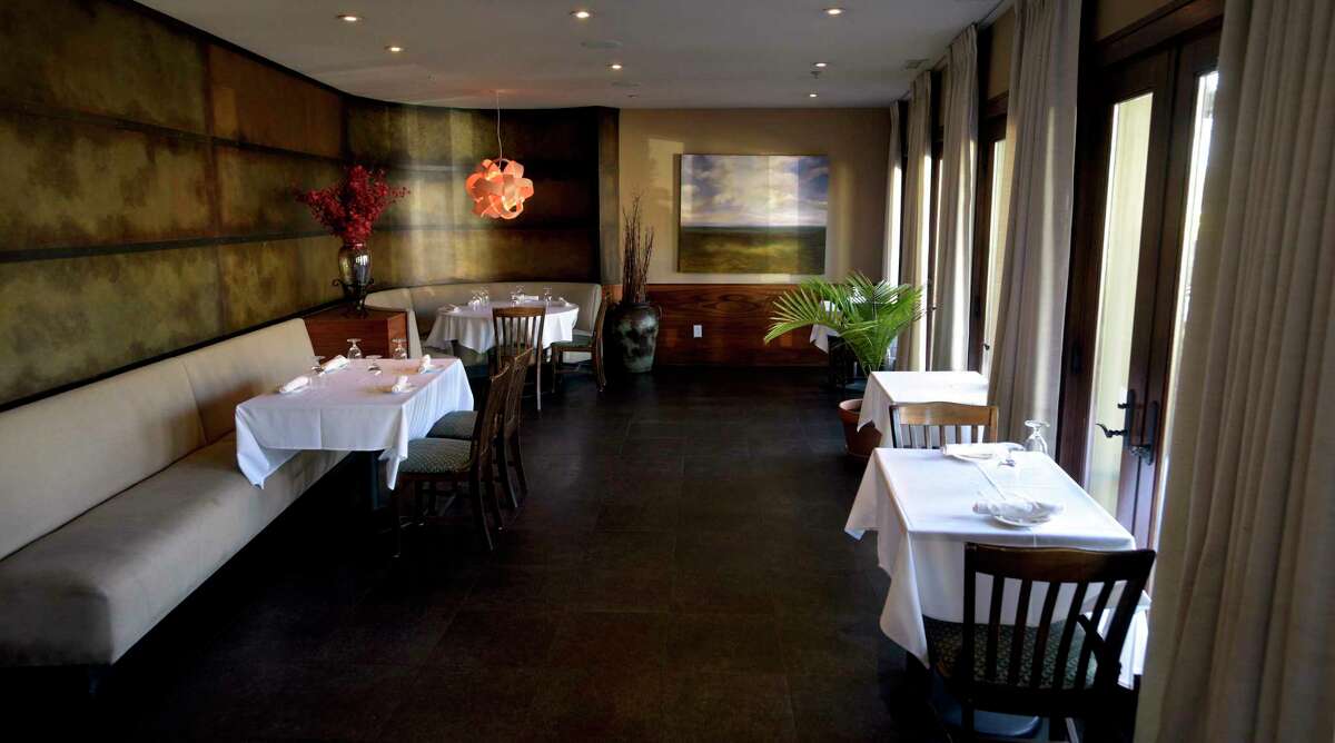 Late afternoon light shines into one of the dining rooms of La Zingara Ristorante in Bethel. Because of COVID restrictions La Zingara has reduced the amount of seating in the restaurant. Governor Ned Lamont recently announced plans to ease those restrictions., Bethel, Conn. Friday, March 5. 2021.