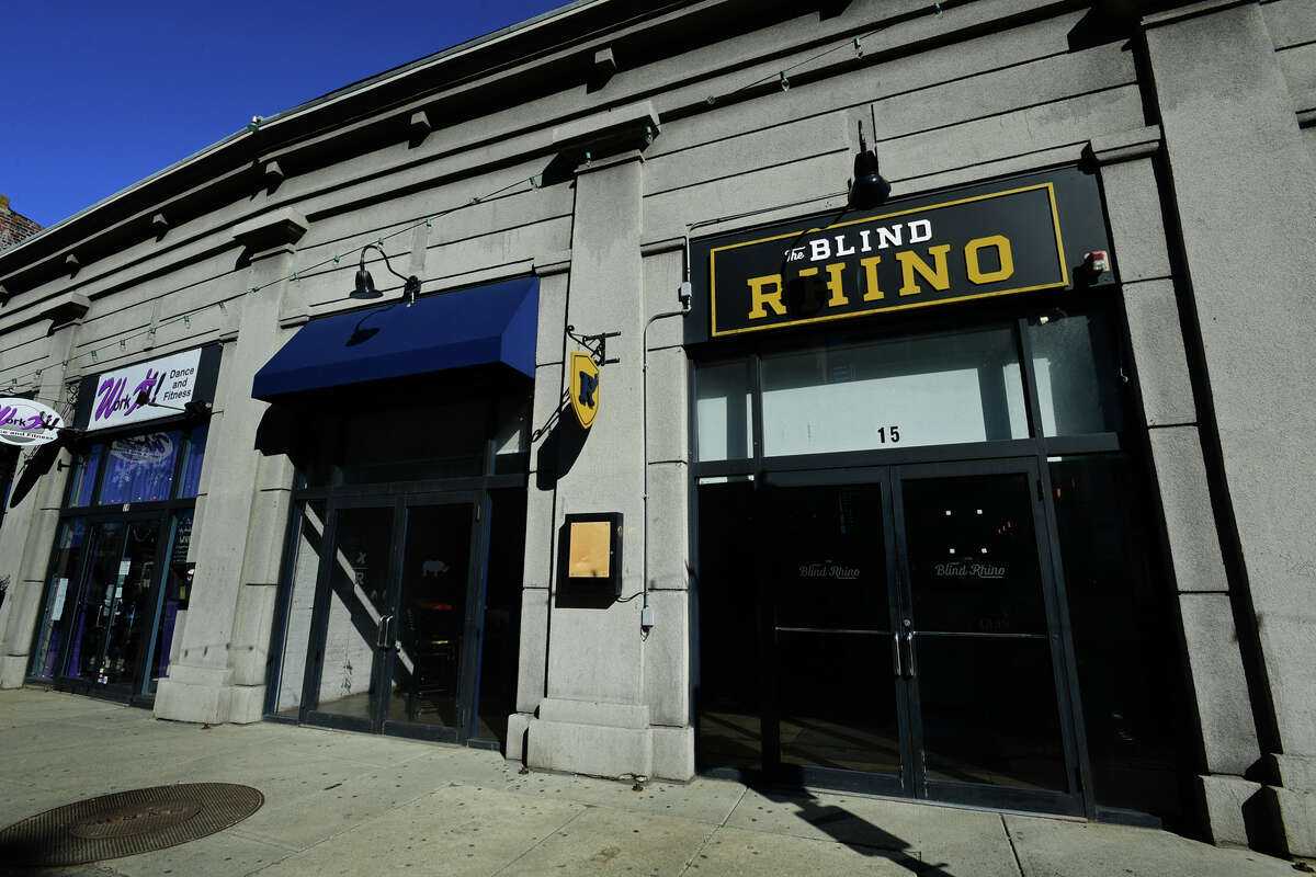 Blind Rhino owner Matt Bacco prepares his restaurant with socially distanced seating Friday, March 4, 2021, in Norwalk, Conn. The state issued a COVID restriction easement for restaurants allowing for more dining with specified distance between tables.