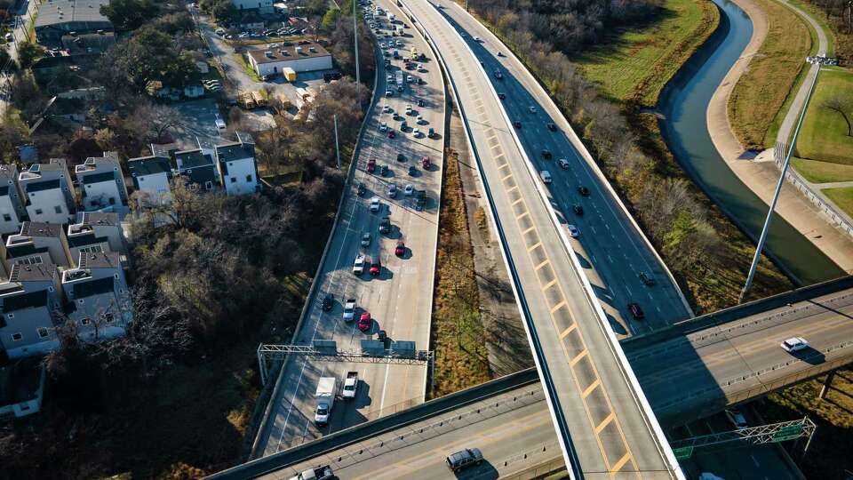 Traffic travels on Interstate 10 near downtown Houston under Houston Avenue on March 3, 2021, in Houston. Officials are considering how to increase capacity on I-10 within Loop 610, including possibly adding managed lanes from the West Loop to downtown Houston.