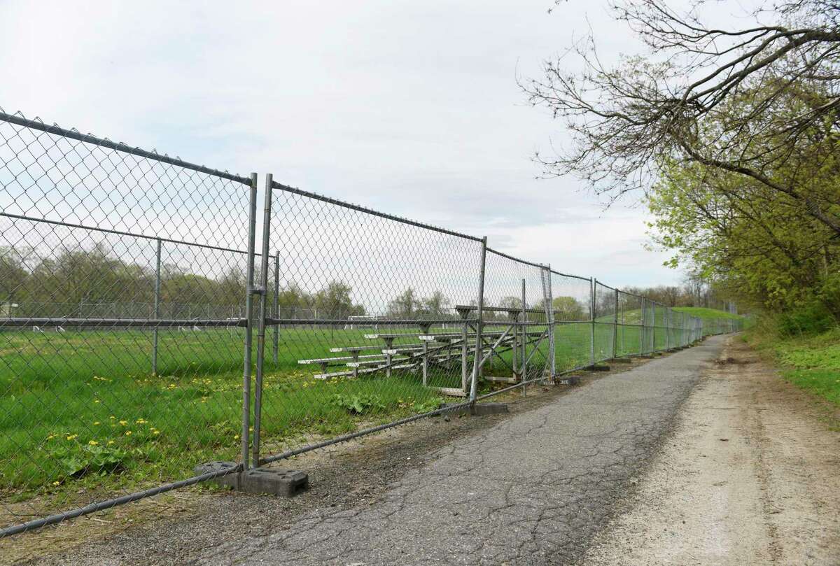 A fence blocks off the contaminated section of playing field at Western Middle School in 2019. An $8 million allocation in the budget will be cut if the BET Budget Committee’s recommendation is approved. The cut is being recommended because the needed DEEP and EPA approvals are not immediately forthcoming and a price for the remediation has not been established. The BET says it will approve the project when the time is right.