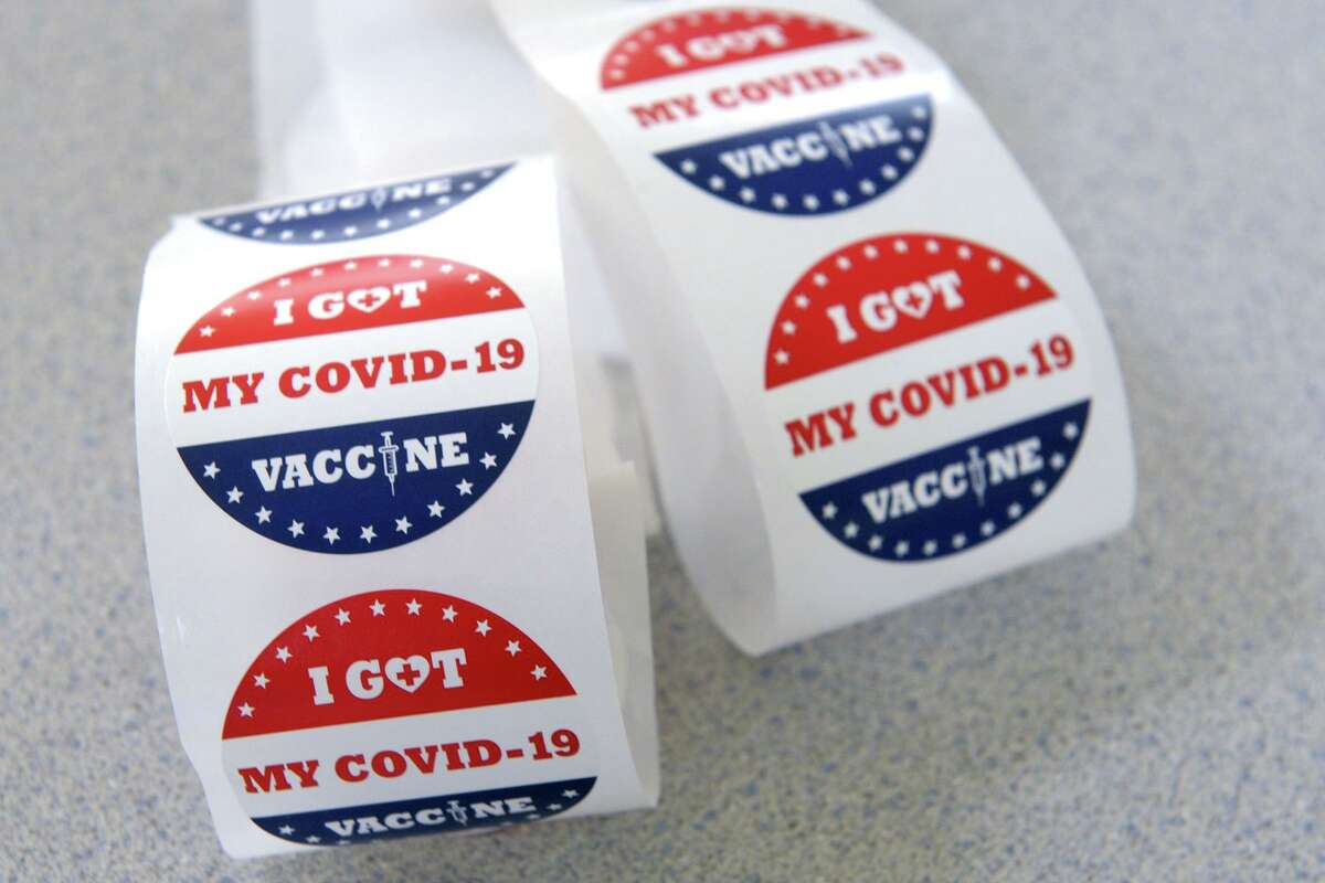 Sticker ready for those receiving COVID-19 vaccinations at the clinic held for teachers and school staff in Trumbull, Conn. March 4, 2021.