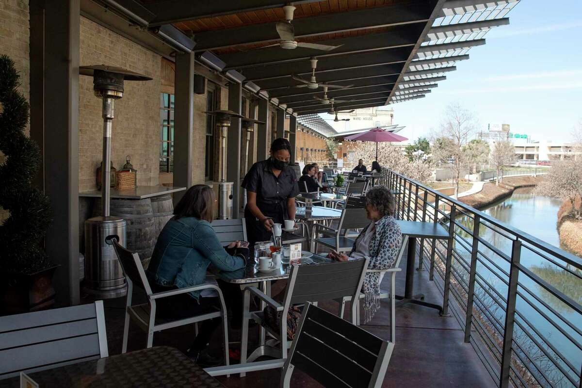 Dorrie Hall and Gail Smith enjoy luck at Jason Dady's Tre Trattoria located at the San Antonio Museum of Art. Dady said he will not change any of the social distancing and mask requirements at any of his restaurants come Wednesday.