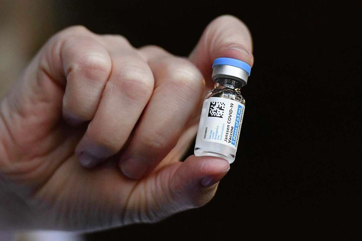 A pharmacist at Hartford Hospital holds the Johnson & Johnson COVID-19 vaccine.