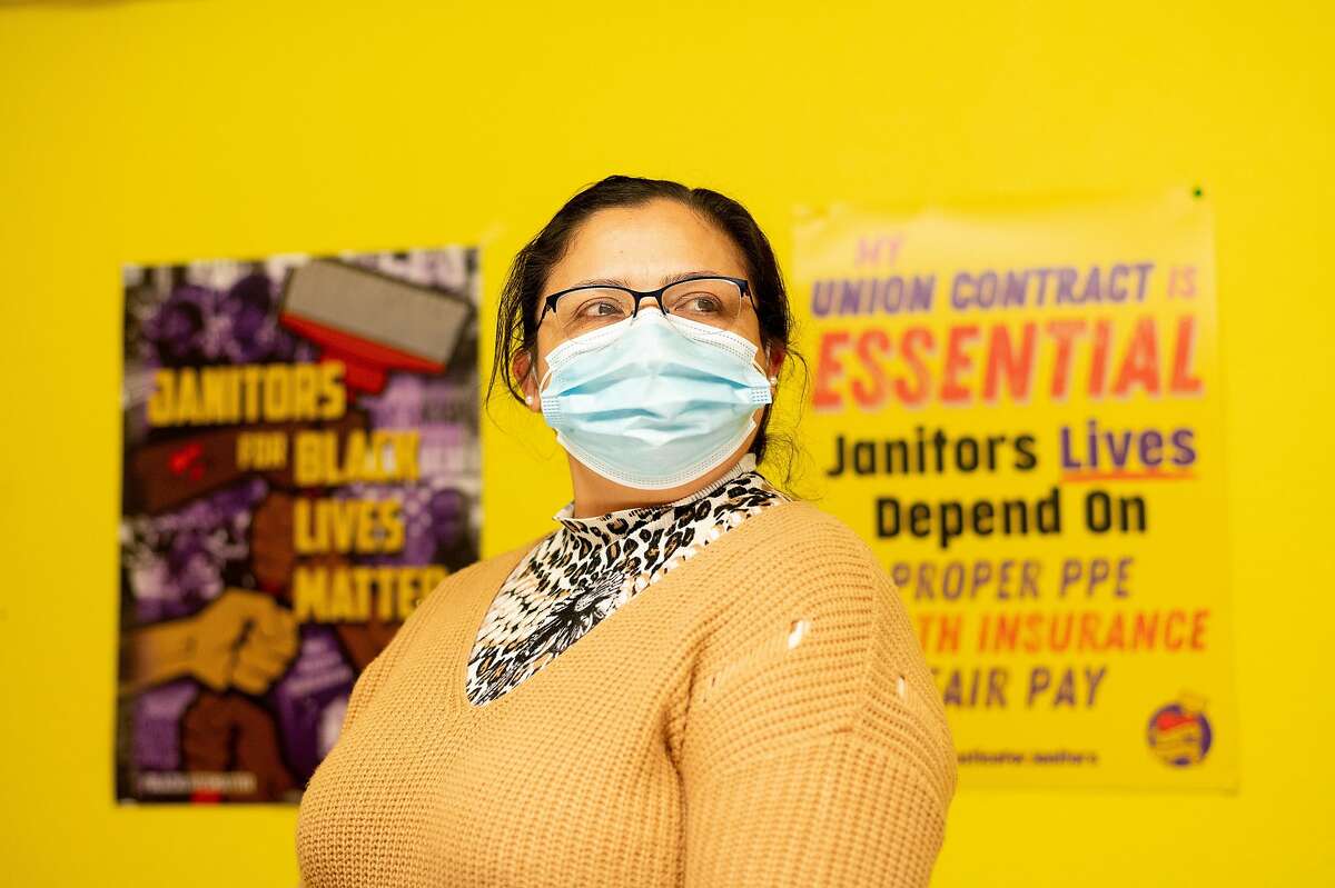 Janitor Gloria Espinoza stands for a portrait at Service Employees International Union (SEIU) Local 87 headquarters on Friday, March 5, 2021, in San Francisco.