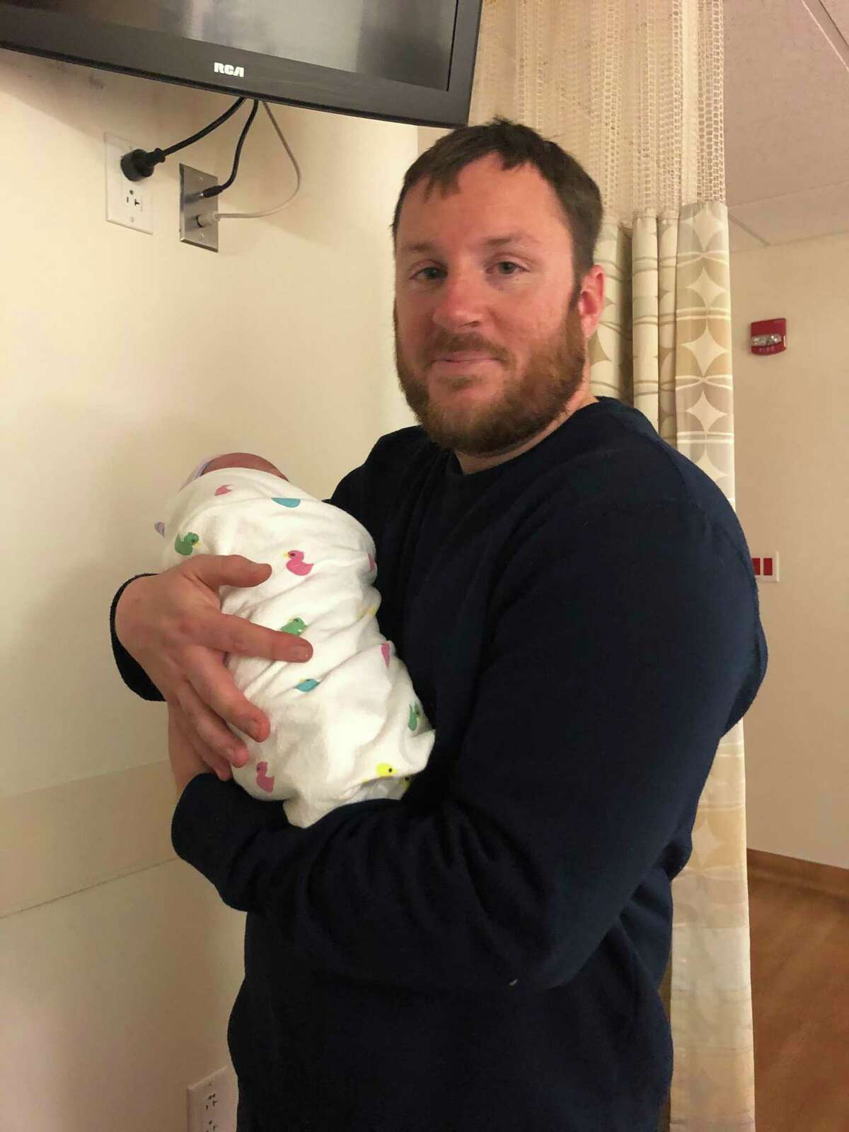 Frank Heisley is enamored by his new baby daughter. The Harris County Sheriff’s Office deputy navigated the treacherous roads to get his wife to the hospital in the nick of time for the delivery.