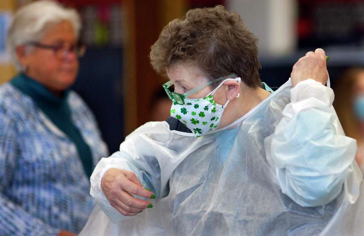 Danbury teachers and school district staff get their Moderna COVID-19 vaccination at a vaccine clinic at Rogers Park Middle School in Danbury, Conn., on Saturday Mar. 6, 2021. Over 900 teachers and staff received the Moderna vaccine during the two-day clinic.