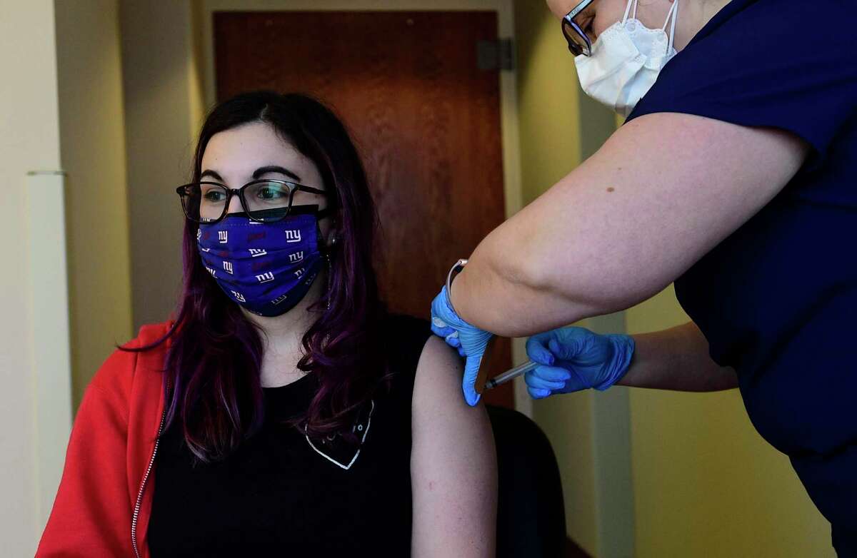 Stamford teachers including Westover's Gina Silvestri, get the Johnson & Johnson vaccine as part of a two-day effort to get all of them inoculated Saturday, March 6, 2021, at Stamford Hospital in Stamford, Conn. The following weekend, secondary staff will get the same opportunity.