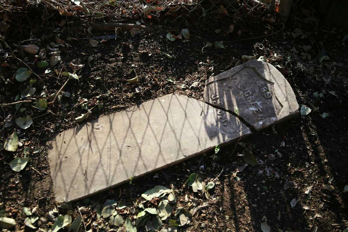 The sun and a nearby fence cast shadows on a headstone that once marked the grave of James Green, a Civil War-era soldier who also served with the famed Buffalo Soldiers infantry and later moved to San Antonio, where he died in 1917. The headstone was discovered at the home of Tommie Hinton Jr. on the city’s East Side.