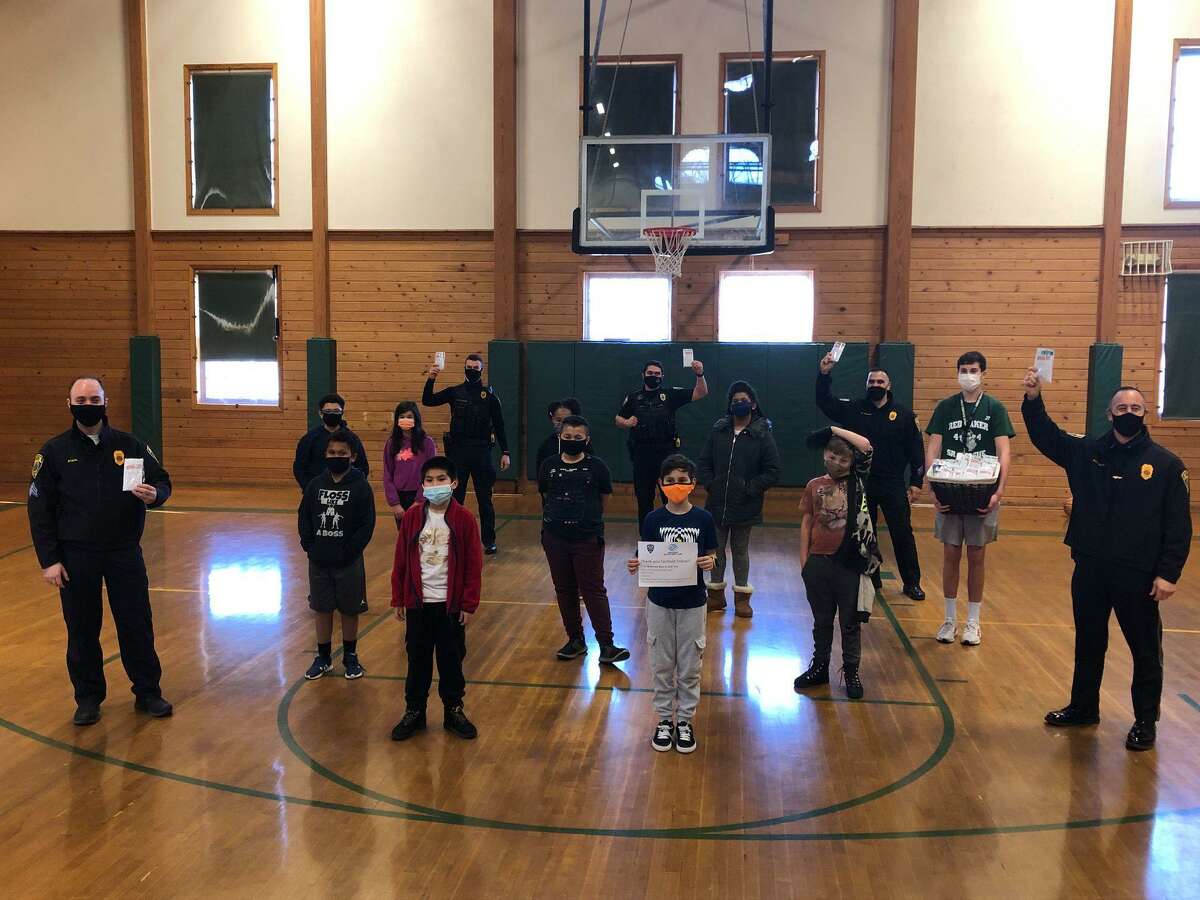 The Wakeman Boys & Girls Club donated 120 'survival kits' to Fairfield Police this weekend and shot hoops with some of the officers.