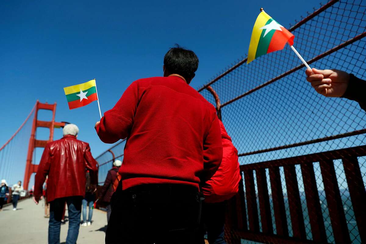 A group walks across the Golden Gate Bridge in solidarity with the people of Myanmar.