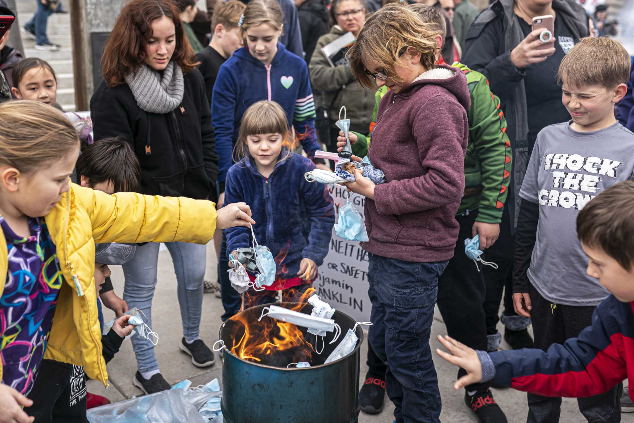 Anti-maskers encourage kids to burn face coverings at Idaho Capitol - Vimarsana News