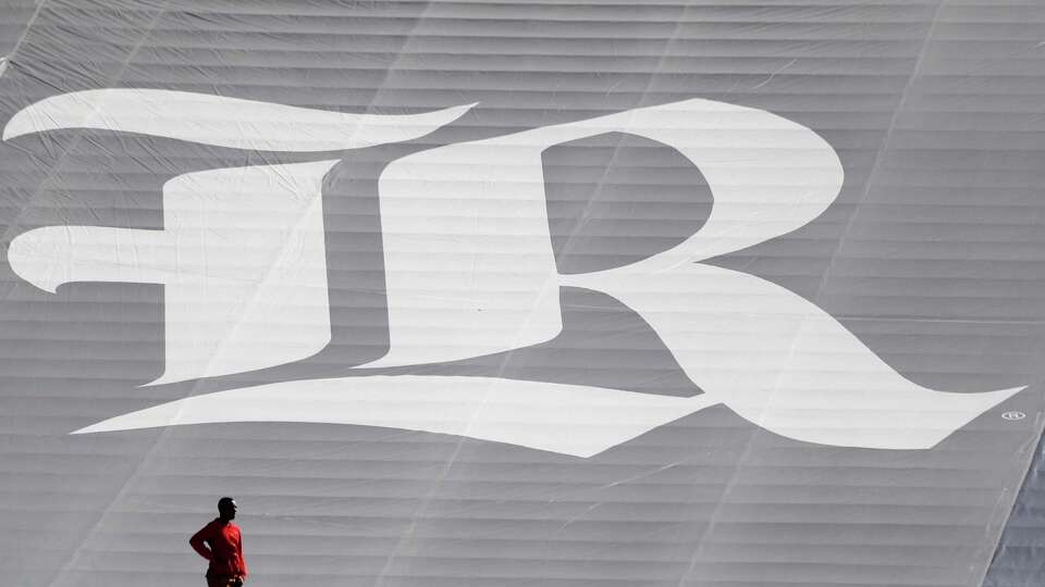 A man stands near the Rice Owls logo in the first half of a college football game at Rice Stadium, Saturday, Nov. 25, 2017, in Houston. ( Karen Warren / Houston Chronicle )