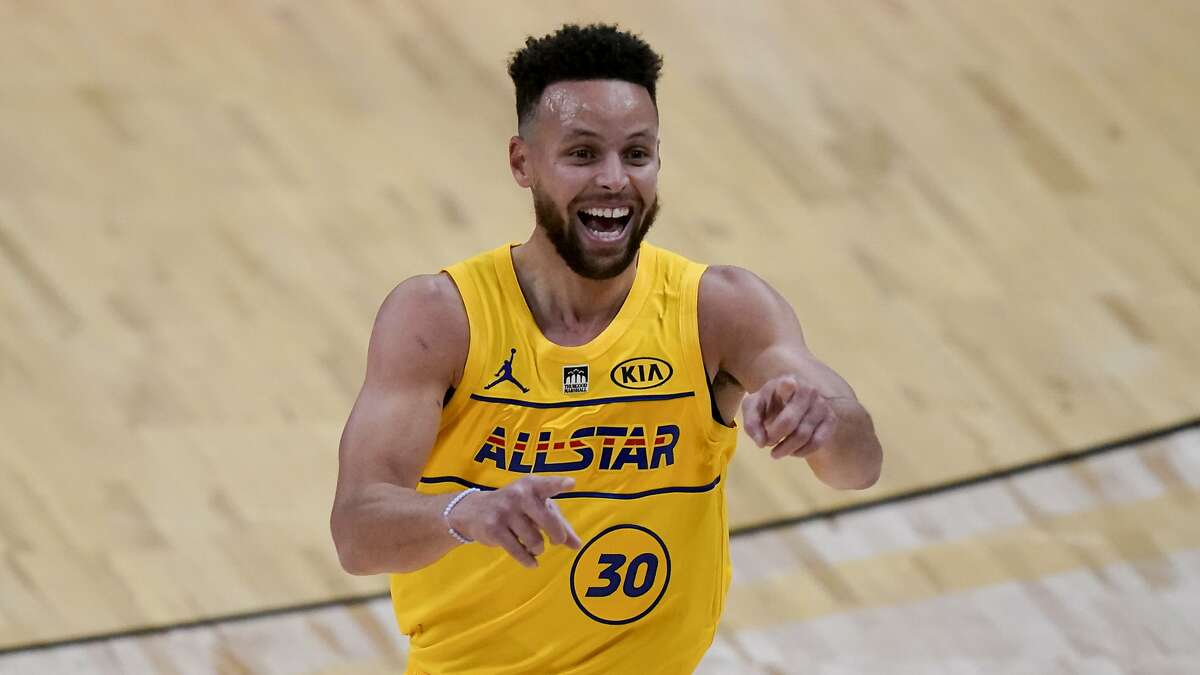 Golden State Warriors guard Stephen Curry celebrates after scoring during the first half of basketball's NBA All-Star Game in Atlanta, Sunday, March 7, 2021. (AP Photo/Brynn Anderson)