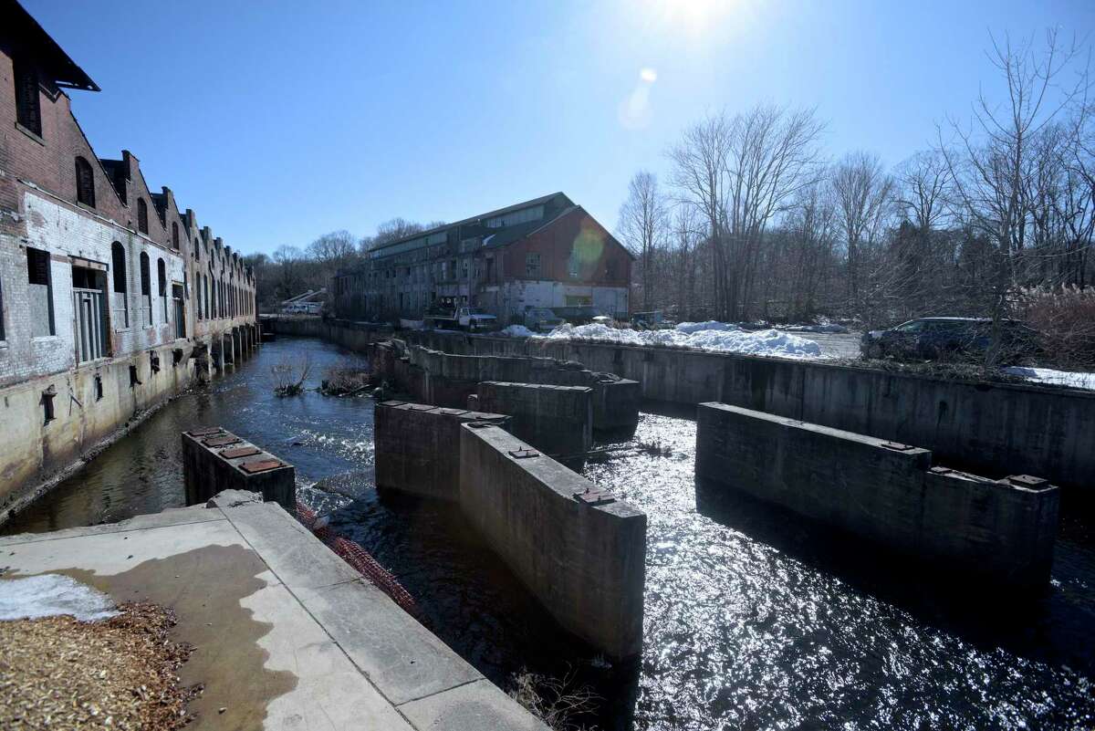 A building on the old Gilbert and Bennett Wire Mill property in Georgetown in Redding. The Norwalk River runs through the property. Redding, Conn, Friday, March 5, 2021.