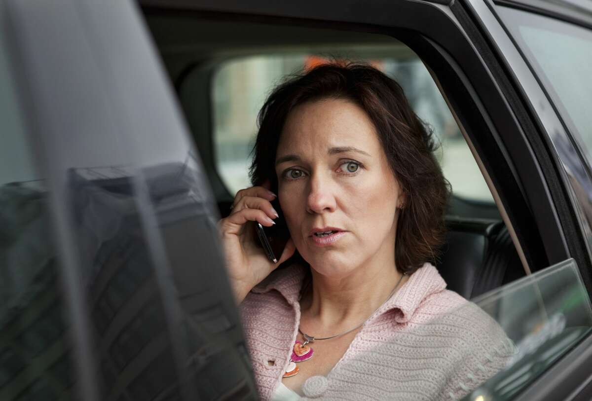 A woman is not happy that her neighbor who damaged her car now works with her.